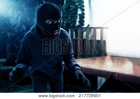 Masked thief sneak into house at night