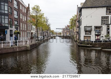 ALKMAAR NETHERLANDS - APRIL 21 2017: Historic old town of Alkmaar North Holland Netherlands typical canal houses