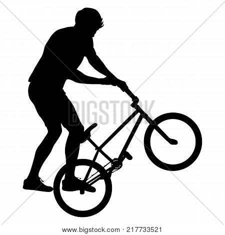 Silhouette of a cyclist male performing acrobatic pirouettes. vector illustration.