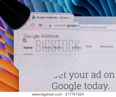 Sankt-Petersburg Russia December 7 2017: Google Adwords homepage website on Apple iMac monitor screen under magnifying glass. Google AdWords is online advertising service.