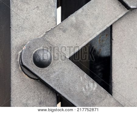 Selective foucs of the steel structure with the rivet in the old railway bridge.