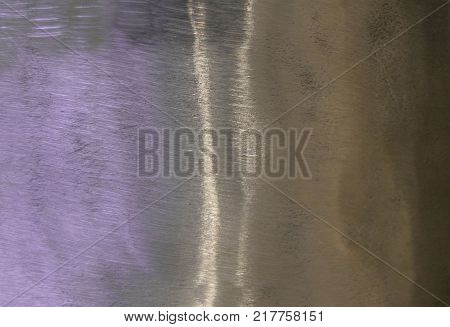 Metal background, texture of titanium, sheet of metal surface. iridescence. Heat tint, variety of colors, violet, purple
