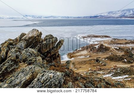 View above big beautiful lake and mountain in winter, Baikal lake, Russia, Siberia