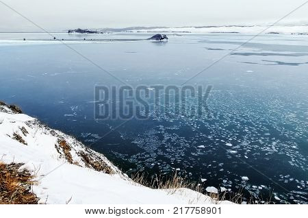 View above big beautiful lake and mountain in winter, Baikal lake, Russia, Siberia