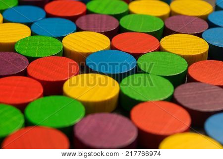 multicolored, wooden, game chips arranged in rows