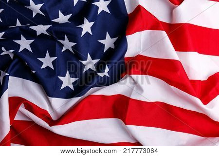 The American flag lies unevenly close up