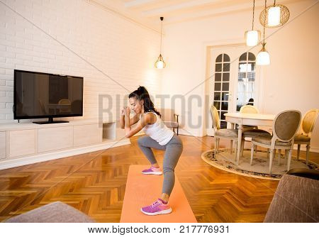 Fit Young Woman Exsercise In The Room