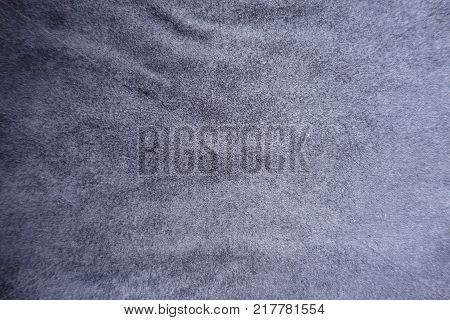 Subdued blue artificial suede fabric surface from above