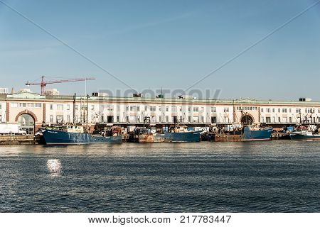 Boston MA USA 04.09.2017 View of harbor from the Boston Waterfront with fishing boat trucks and boats anchored Massachusets USA
