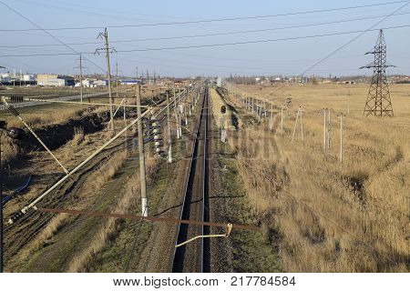 Plot railway. Top view on the rails. High-voltage power lines for electric trains.