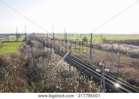 Plot railway. Top view on the rails. High-voltage power lines for electric trains.