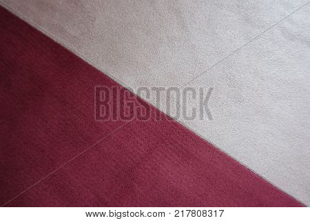 Cream and red artificial suede sewn together diagonally