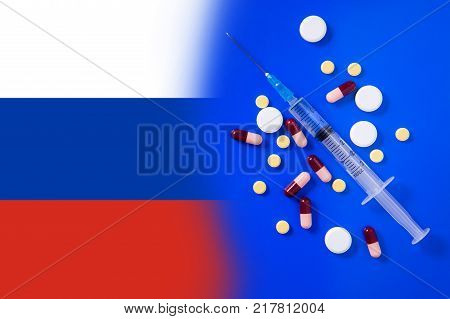 Medical syringe with doping against the background of the flag of Russia. Concept of doping in sport