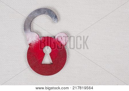 Symbolic wooden lock on a white background. Copy space