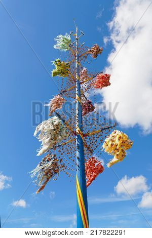 Maypole to celebrate Midsummer decorated with colorful ribbons typical design from Aaland part of Finland in northern Europe