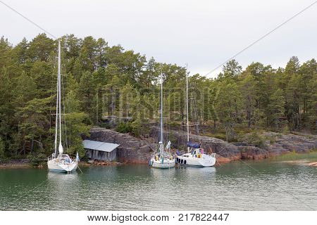 GETA FINLAND - JUL 18 2017: Sailing boats in a bay to the island Aaland part of Finland in northern Europe part of Finland in northern Europe. July 18 2017