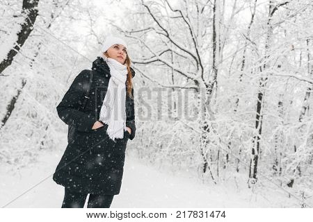 Beautiful Young Girl In A White Winter Forest