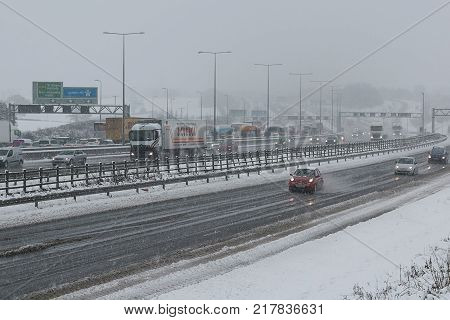 Hemel Hempstead UK - December 10 2017:Traffic on the British motorway M1 during the snowstorm