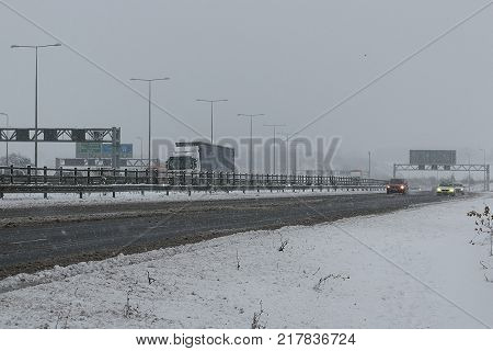 Hemel Hempstead UK - December 10 2017:Traffic on the British motorway M1 during the snowstorm