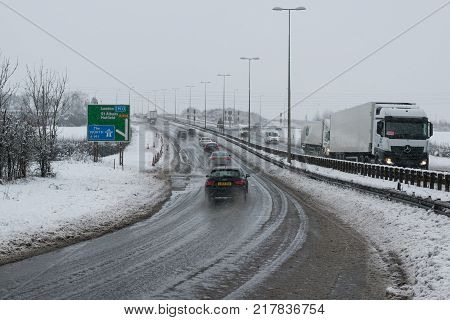 Hemel Hempstead UK - December 10 2017: Traffic on the junction 9 motorway M1 during the snowstorm