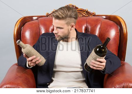 Man Degustator With Beard, Stylish Hair Hold Wine Bottle