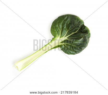 Single leaf of Chinese flat cabbage (Brassica chinensis) or Tah Tsai lettuce isolated on white. Tah Tsai or (Tatsoi) a commly used green leaf vegetable in Chinese and oriental dishes.