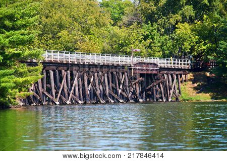 Rustic wooden trestle across the Bearskin State Trail in Minocqua Wisconsin