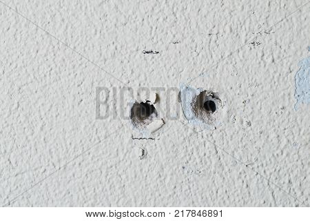 Two holes in the wall foam or aerated concrete for the installation of dowels for bolts
