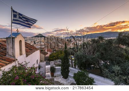 View of Lycabettus hill from Anafiotika neighborhood in the old town of Athens, Greece.