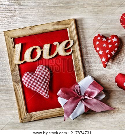 Valentine's Day Background hearts homemade gift box and red frame with free space for text. top veiw