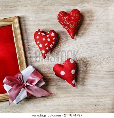 Valentine's Day Background hearts homemade gift box and red frame with free space for text. top veiw