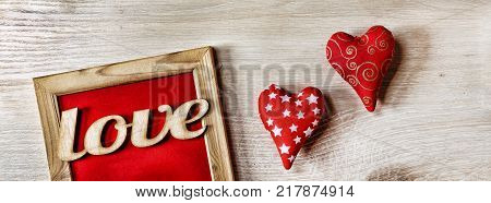 Valentine's Day Background hearts homemade gift box and red frame with free space for text. top veiw