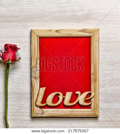 Valentine's Day. Happy Valentine's Day card, gift box and red rose on wood background, banner