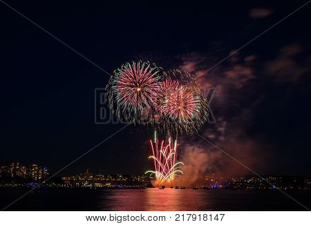 Celebration multicolored fireworks copy space. Canada Day holidays salute. New Year celebration colorful fireworks.