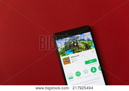 Los Angeles, december 11, 2017: Smartphone with Minecraft game application in google play store on red background