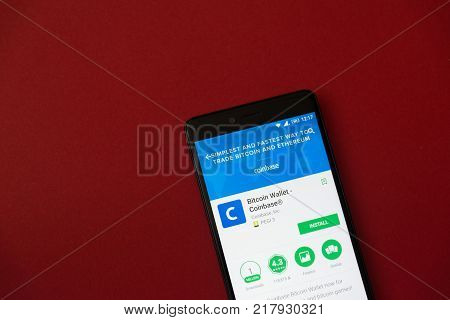 Los Angeles, december 11, 2017: Smartphone with Bitcoin wallet coinbase application in google play store on red background