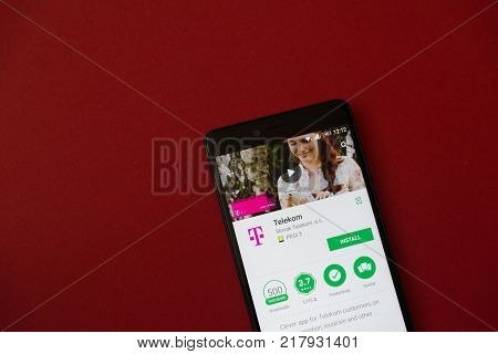 Los Angeles, december 11, 2017: Smartphone with Telekom application in google play store on red background