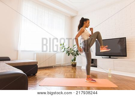 Fit Young Woman Exsercise In The Room