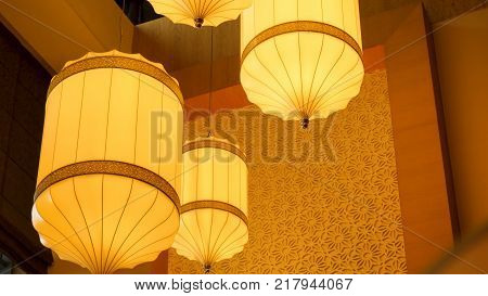 Yellow, Orange Paper Lamp Traditional Lanna Style. Traditional Nepalese, Chenese Or Asian Lamp Under