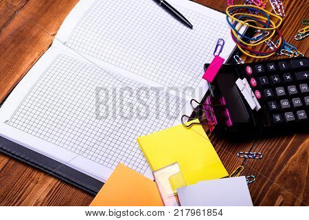 Moneybox With Pig Face Near Organizer And Pen.
