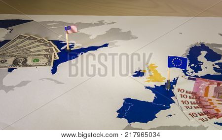 Dollar and euro, american and European flags over EU and US map, symbolizing the Transatlantic Trade and Investment Partnership or TTIP, with the aim of promoting trade and multilateral economic growth