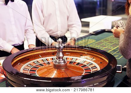 Casino roulette people make bets. The concept of gambling