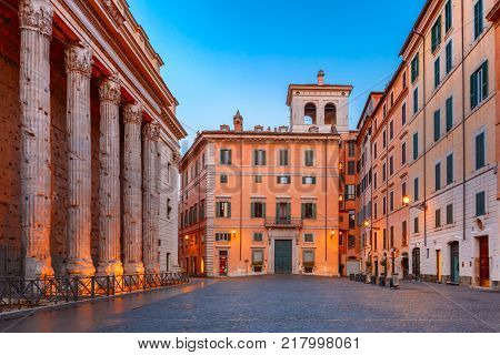 Square Piazza di Pietra, located in the historic center of Rome, surviving side colonnade of the Temple of Hadrian on the left, in the morning, Italy.