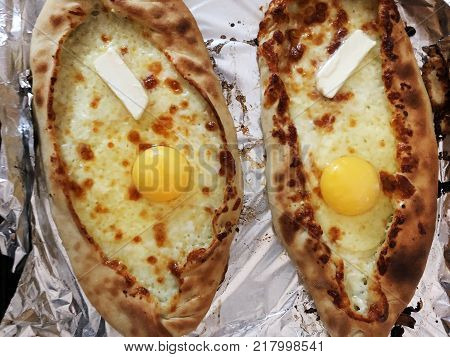 Adjarian khachapuri, open bread stuffed with cheese and egg yolk. Khachapuri is a traditional dish of Georgian cuisine.