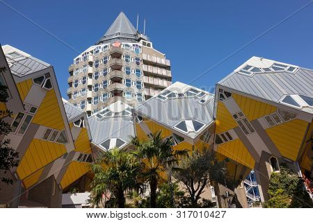 Rotterdam, Holland - July 30, 2019: Innovative cube houses in Rotterdam and Blaaktower, called the pencil, designed by architect Piet Blom  