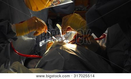 Treating A Patient In An Operating Room In Honduras