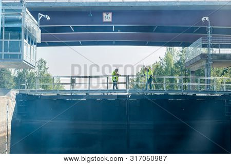 Lappeenranta, Finland - August 7, 2019: Lock And Bridge On The Saimaa Canal At Malkia. Engineers Are