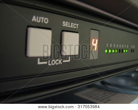 Servers Stack With Disc Drives In A Rack And Glowing Lights