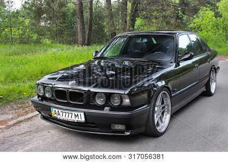 Kiev, Ukraine. May 17, 2014. Bmw M5 (e34) Against The Background Of The Forest. On The Bmw Wheels Sc