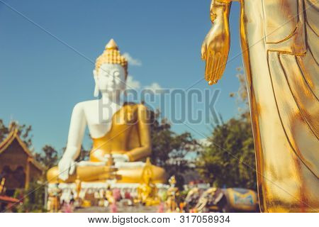 Buddha Statue Outdoor In Thai Temple Vintage Color Tone Travel Landmark In Doi Kham Chiangmai